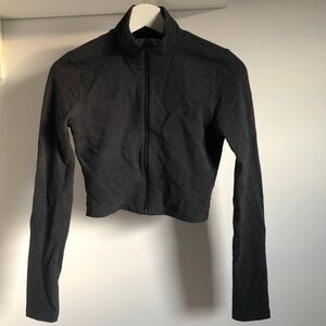 Aritzia ୨୧ TNA waist zip longsleeve active top